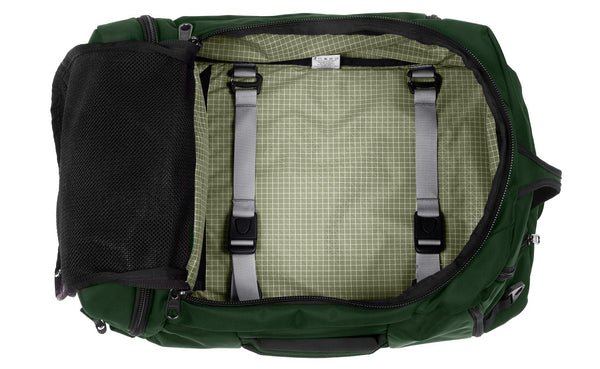 An open Techonaut 45 with a Wilderness (forest green) exterior and a Taiga (olive green) interior.